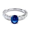 Oval cut blue sapphire and white diamond ring in white gold