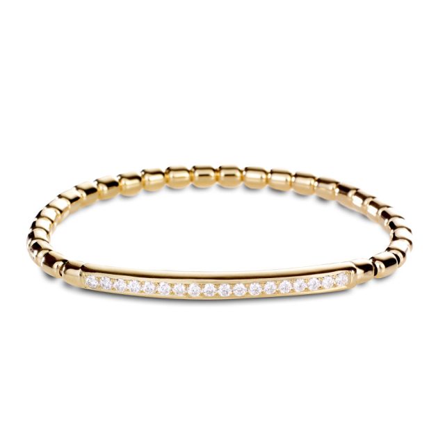 One row stretch bracelet in yellow gold and white diamonds