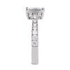 Emerald cut engagement ring in platinum with round white diamonds