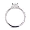 Emerald cut engagement ring in platinum with round white diamonds