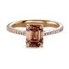 Engagement ring in rosé gold with emerald cut champagne coloured diamond