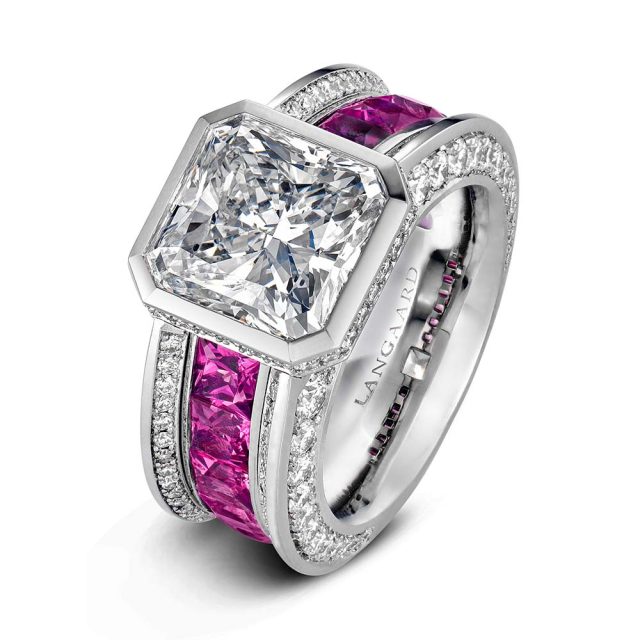 Diamond ring in platinum with radiant cut diamond and pink spinels