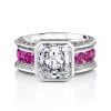 Diamond ring in platinum with radiant cut diamond and pink spinels