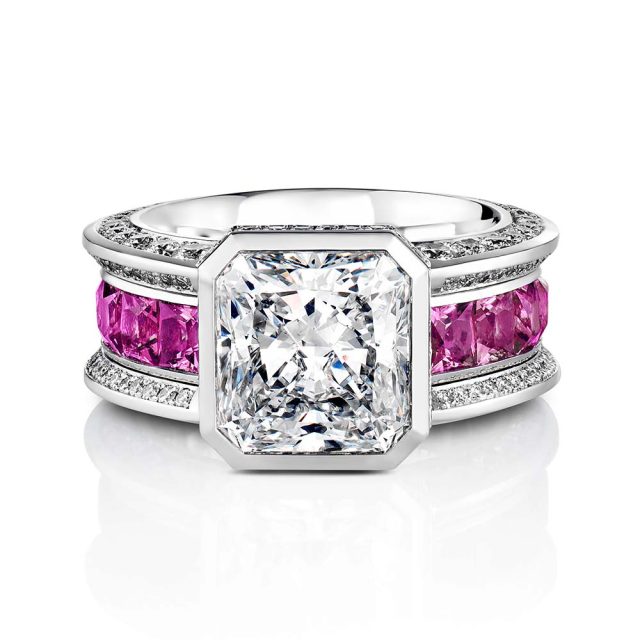 Diamond ring in platinum with radiant cut diamond and pink spinels