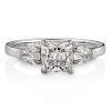 Engagement ring in platinum with pear shaped and cushion cut diamonds