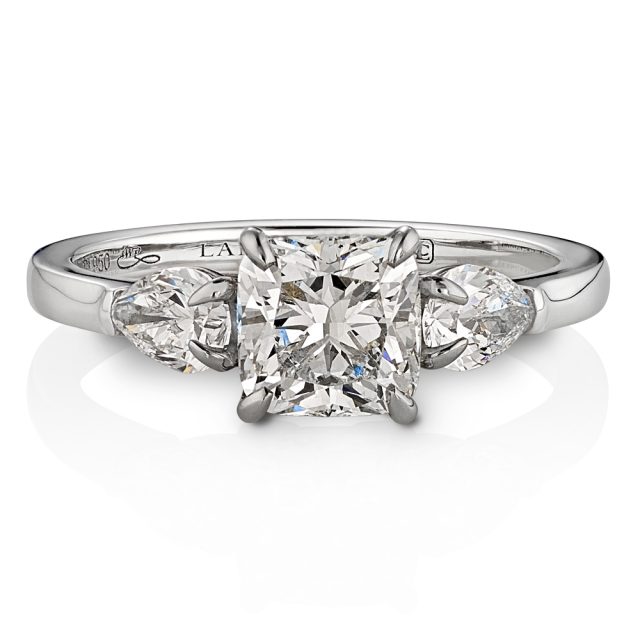 Engagement ring in platinum with pear shaped and cushion cut diamonds